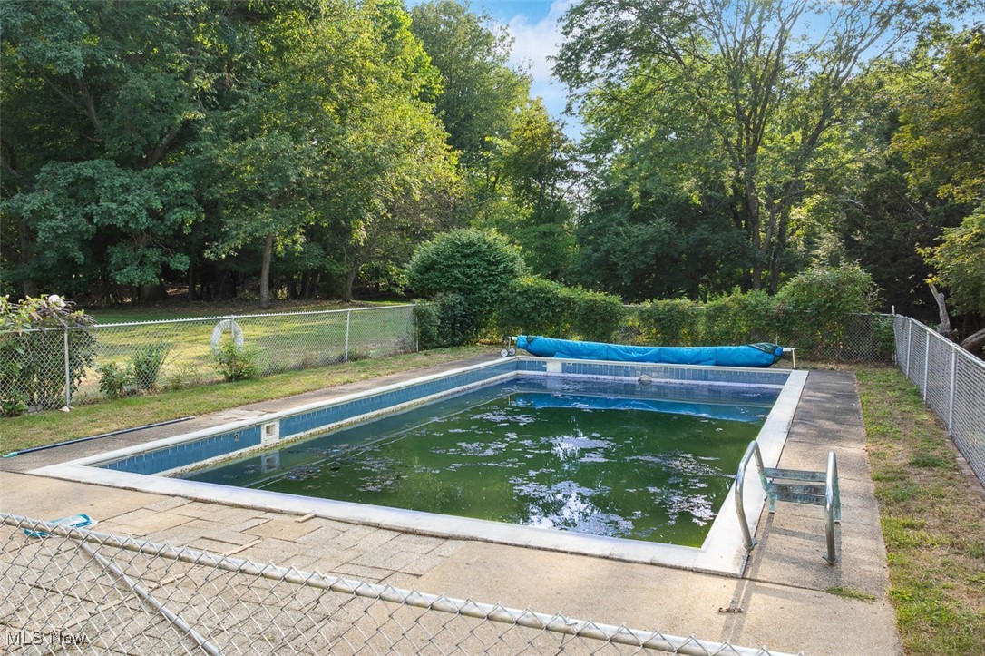 256 Everhard Road Southwest North Canton, OH 44709 - Photo 37 of 45 View of swimming pool with a fenced backyard