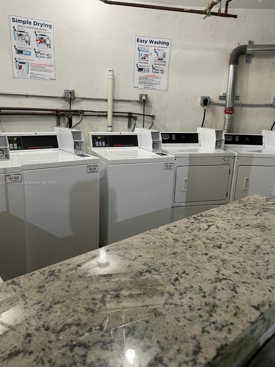 North Beach Miami, FL 33141 - Photo 9 of 10 a kitchen with a sink and cabinets