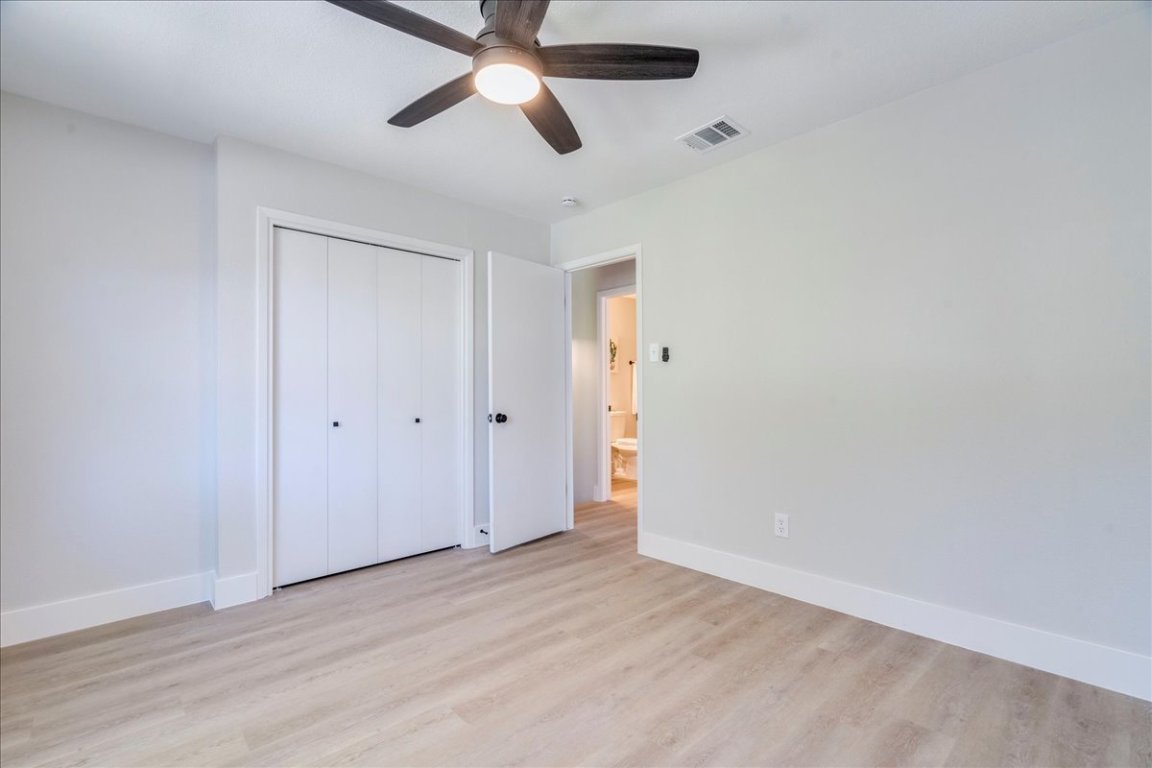 11301 Jollyville Road, Unit F2 Austin, TX 78759 - Photo 16 of 29 wooden floor in an empty room