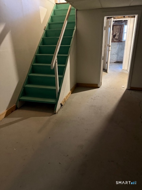 280 East Main Street, Unit E2 Clinton, CT 06413 - Photo 17 of 20 Interior basement stairs lead to a usable space, door to storage room and interior door to shared laundry area.