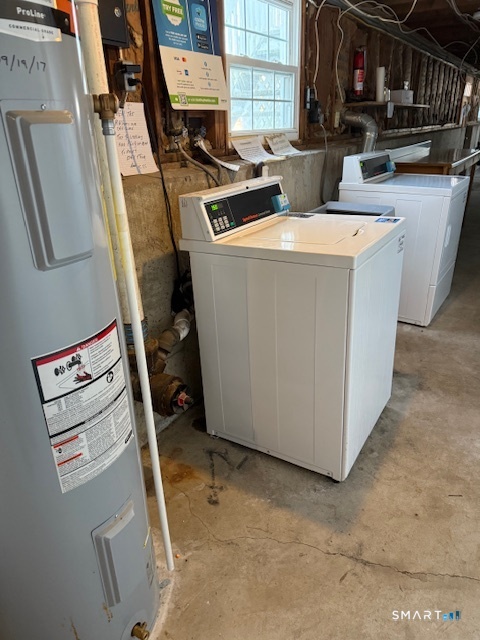 280 East Main Street, Unit E2 Clinton, CT 06413 - Photo 20 of 20 The shared laundry are for the building E is accessed through the unit's basement storage area.