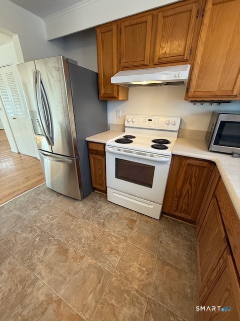 280 East Main Street, Unit E2 Clinton, CT 06413 - Photo 5 of 20 The kitchen has new vinyl flooring installed and a newer stainless refrigerator.