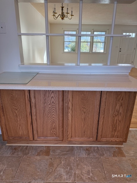 280 East Main Street, Unit E2 Clinton, CT 06413 - Photo 6 of 20 The Breakfast bar has a granite countertop and open pass-through to the dining room area. Additional four cabinets below for storage
