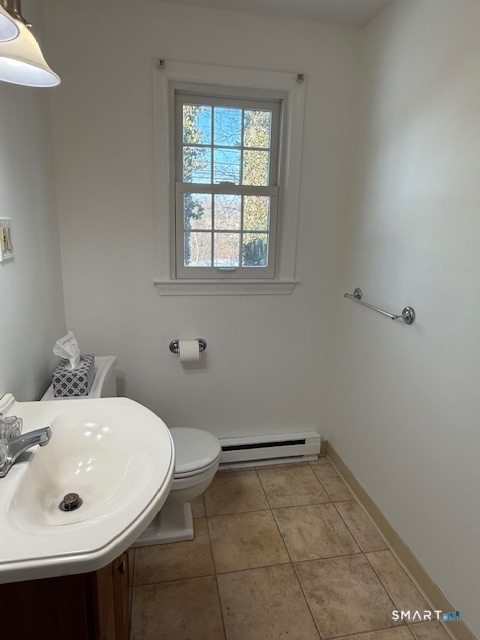 280 East Main Street, Unit E2 Clinton, CT 06413 - Photo 8 of 20 The first floor powder room has a vanity with storage beneath.