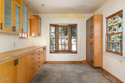 a spacious bathroom with a double vanity sink a mirror and a bathtub
