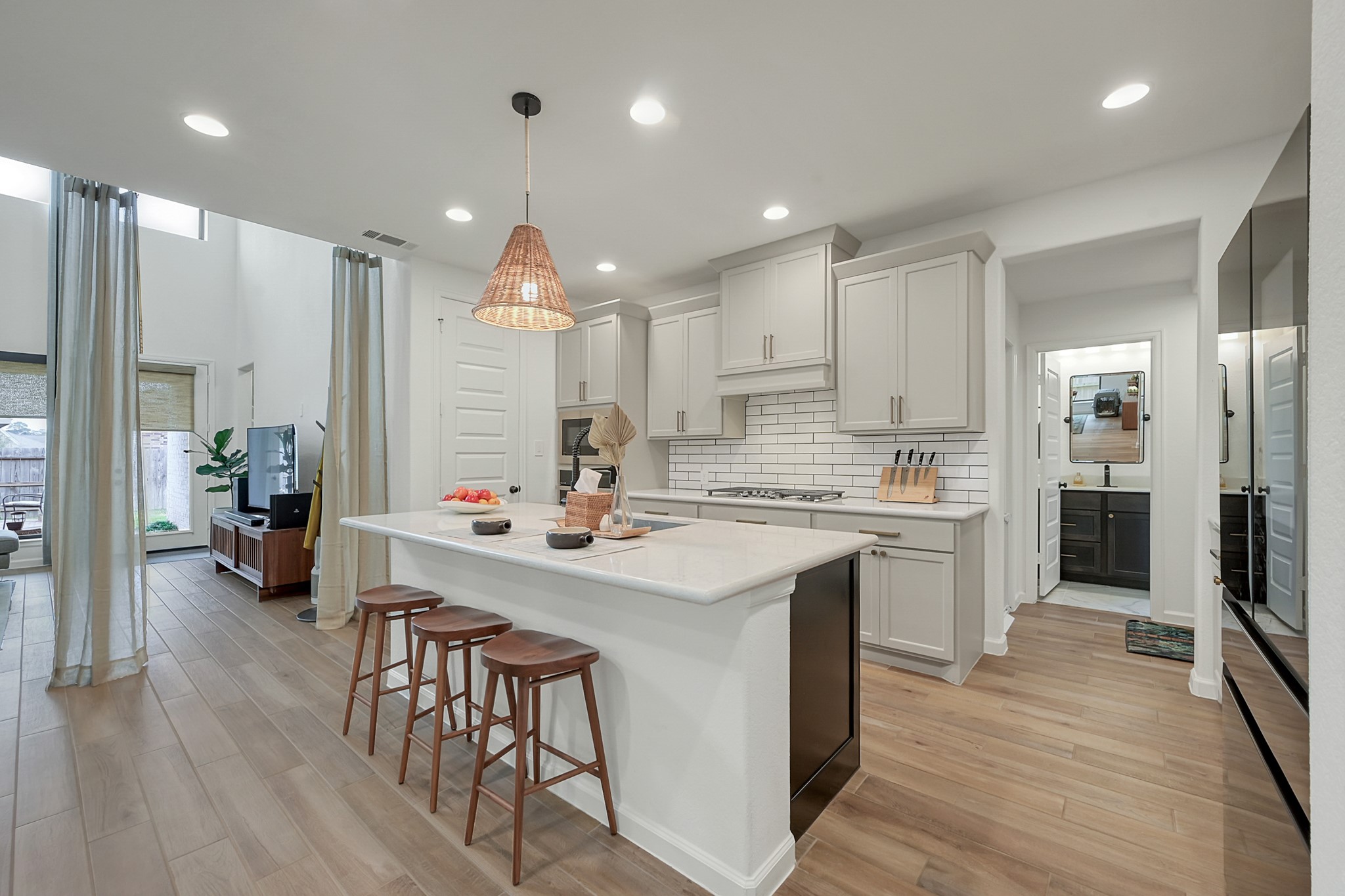647 Sand Branch Drive Conroe, TX 77304 - Photo 5 of 19 a kitchen with counter top space a sink stainless steel appliances and cabinets