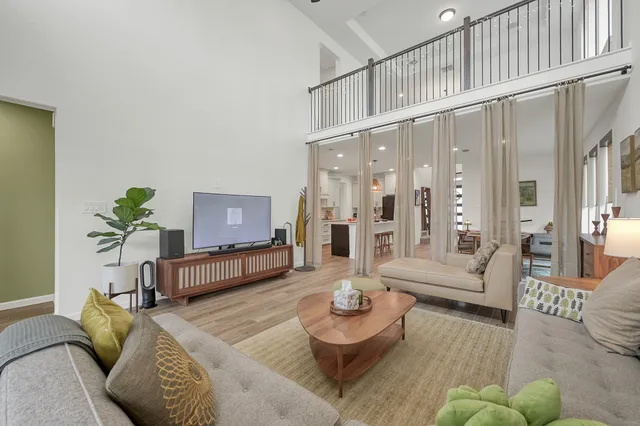 a living room with furniture and a table