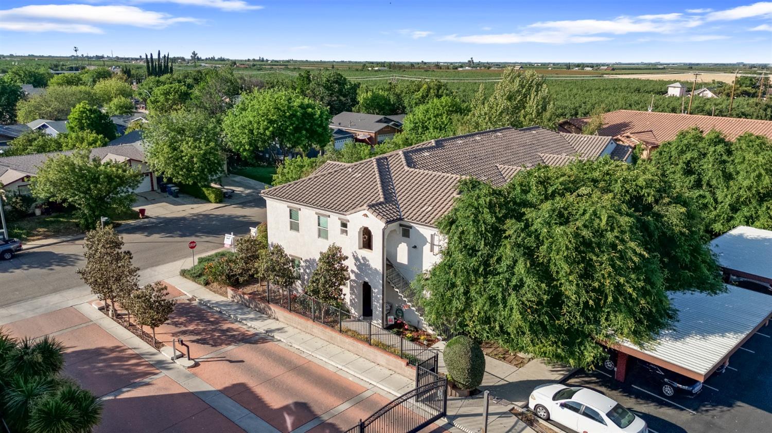 140 Ivy Avenue, Unit A5 Patterson, CA 95363 - Photo 3 of 26 an aerial view of a house with garden space and street view