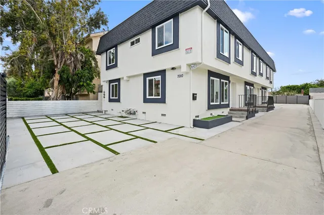 a building exterior with stairs and trees