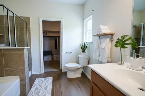 a bathroom with a sink toilet and shower