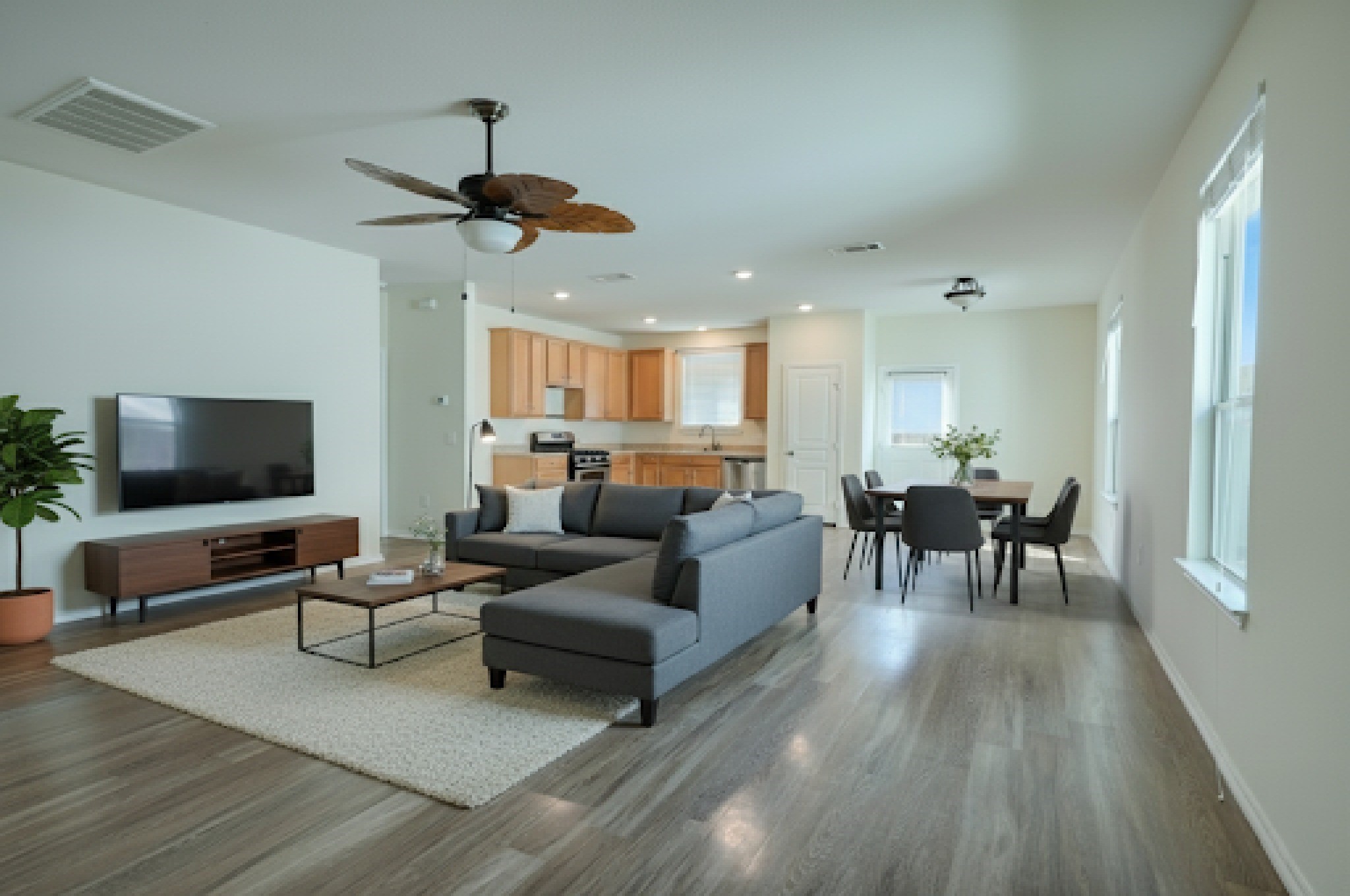 4611 Windmill Run Drive Houston, TX 77069 - Photo 4 of 36 a living room with furniture and a flat screen tv
