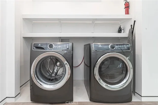 a bathroom with a sink a vanity a mirror and shower