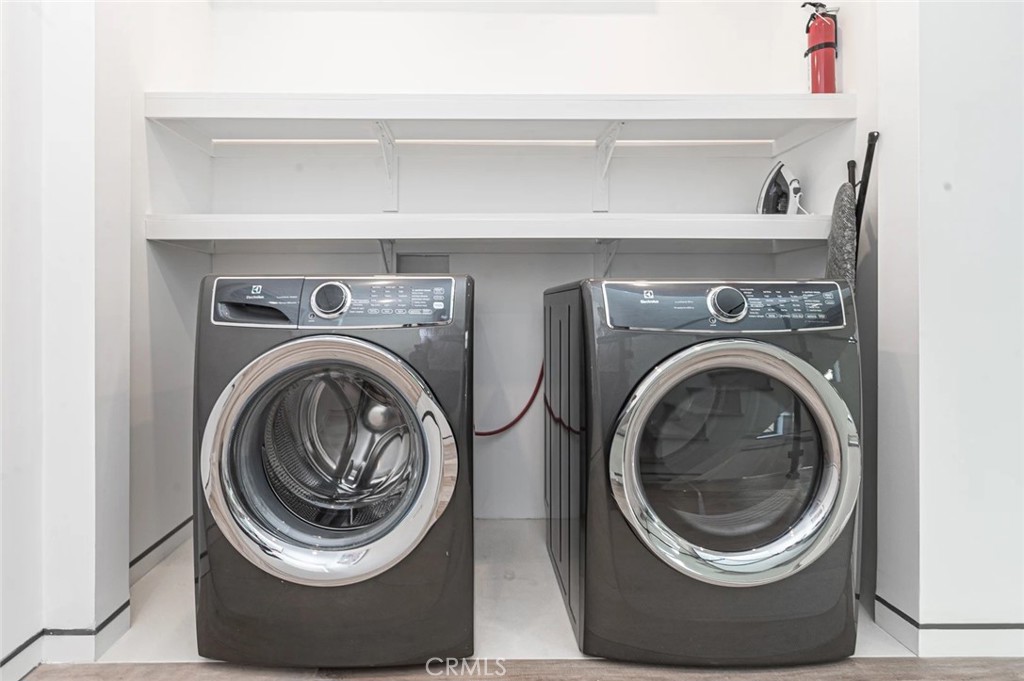 1034 West Balboa Boulevard, Unit B Newport Beach, CA 92661 - Photo 21 of 33 a close up view of washer and dryer
