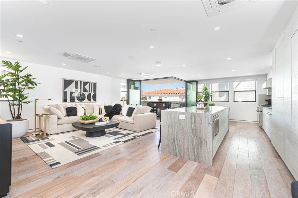 1034 West Balboa Boulevard, Unit B Newport Beach, CA 92661 - Photo 3 of 33 a living room with furniture wooden floor and a table