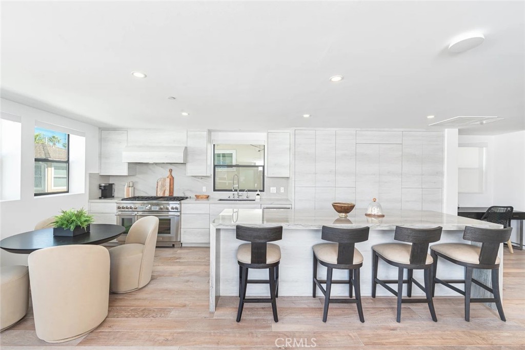 1034 West Balboa Boulevard, Unit B Newport Beach, CA 92661 - Photo 4 of 33 a view of a dining room with furniture and wooden floor