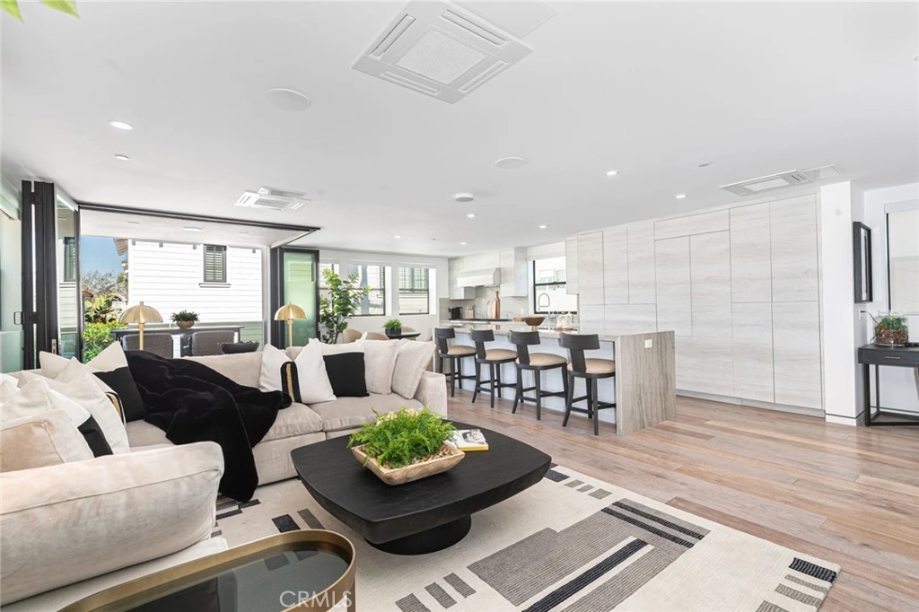 1034 West Balboa Boulevard, Unit B Newport Beach, CA 92661 - Photo 6 of 33 a living room with furniture and a wooden floor