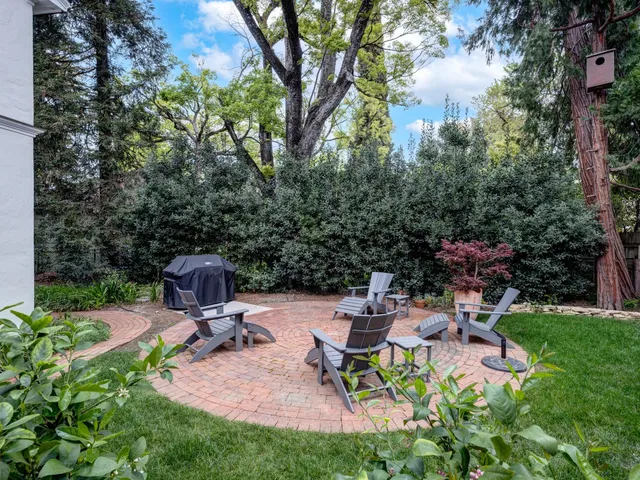 a view of a backyard with sitting area and furniture