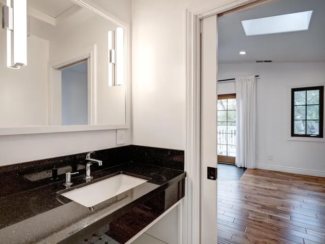 a bathroom with a sink and a mirror