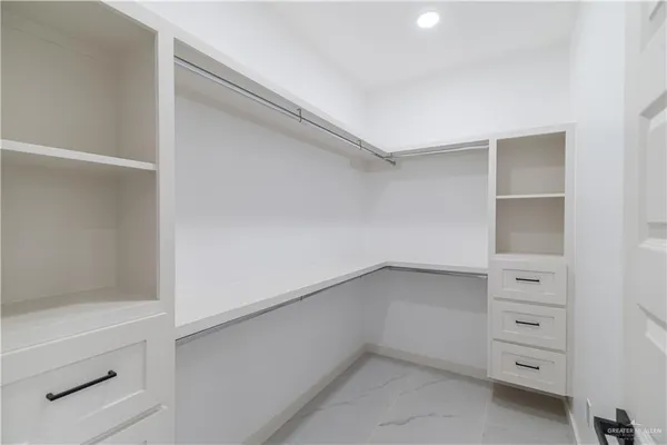 a view of an empty walk in closet