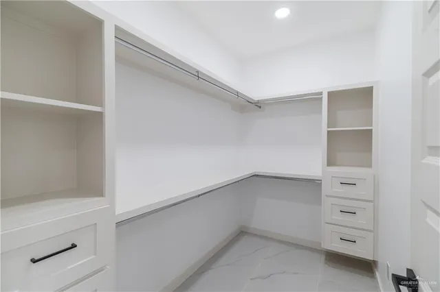 a view of an empty walk in closet