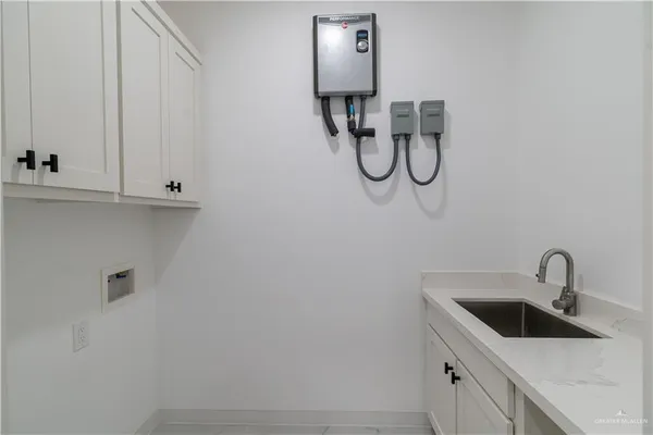a bathroom with a sink and mirror
