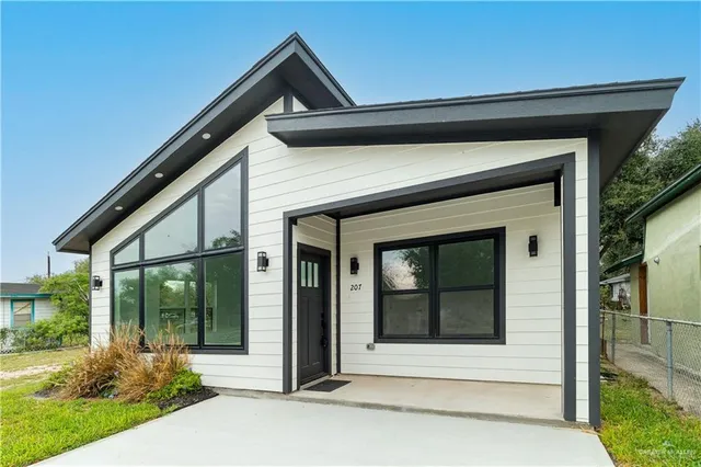 a front view of a house with a porch