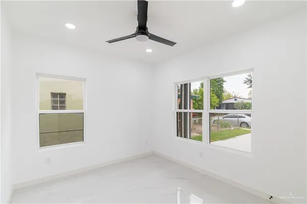 a view of an empty room with a window