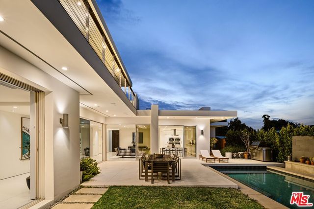 a view of a house with a potted plant and a window