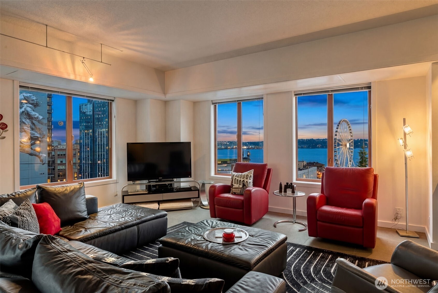 a living room with furniture and a flat screen tv