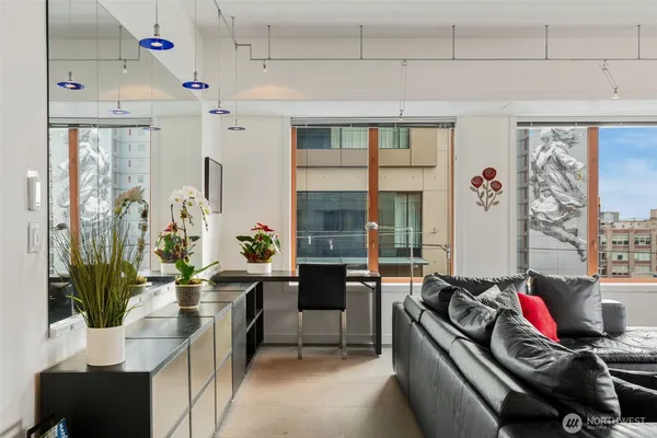 a living room with furniture and a flat screen tv