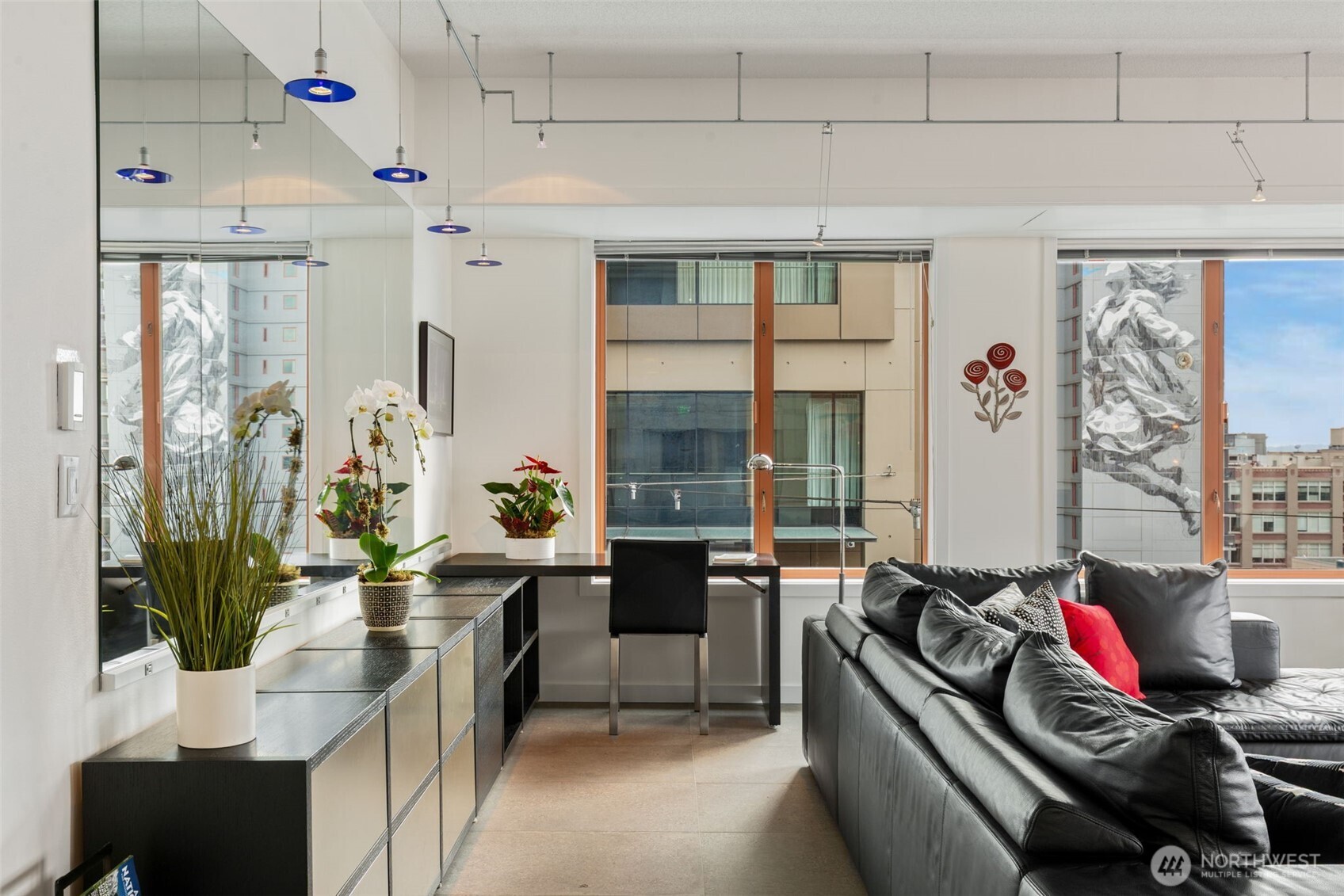 98 Union Street, Unit 206 Seattle, WA 98101 - Photo 20 of 35 a living room with furniture and a large window