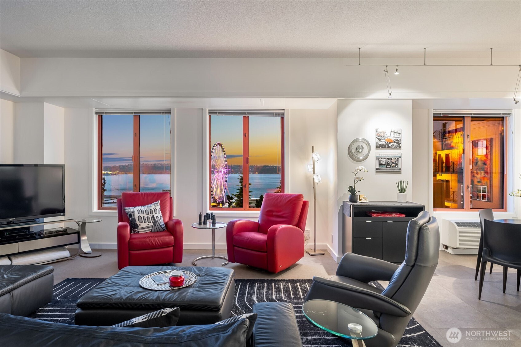 98 Union Street, Unit 206 Seattle, WA 98101 - Photo 23 of 35 a living room with furniture or couch and a flat screen tv