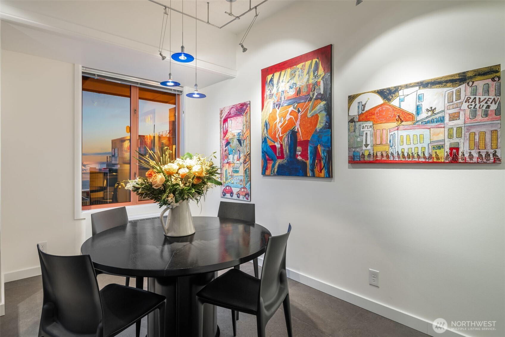 98 Union Street, Unit 206 Seattle, WA 98101 - Photo 26 of 35 a view of a dining room with furniture and chandelier