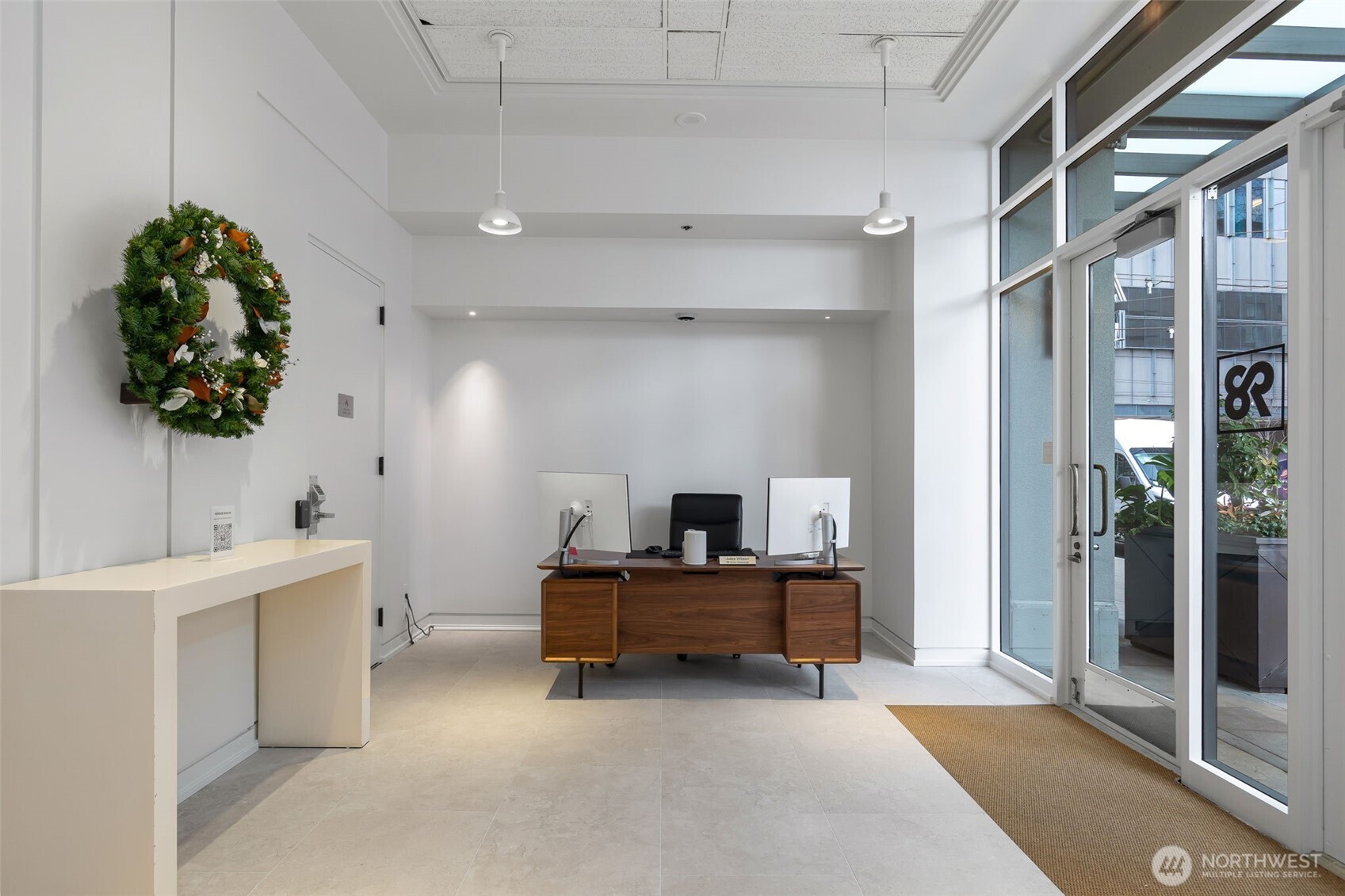 98 Union Street, Unit 206 Seattle, WA 98101 - Photo 31 of 35 a bedroom with a bed and a potted plant on the dresser