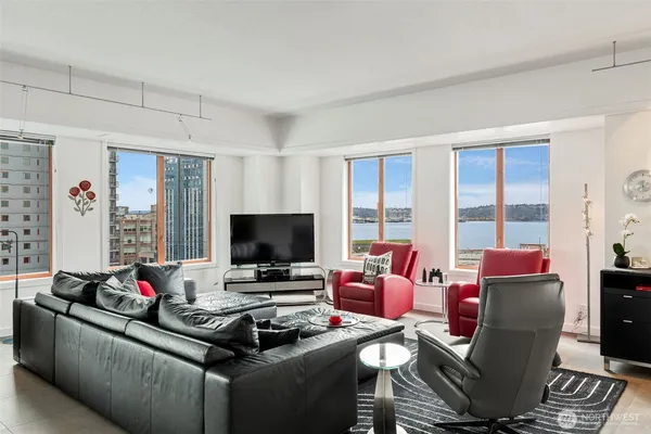 a living room with furniture and a flat screen tv
