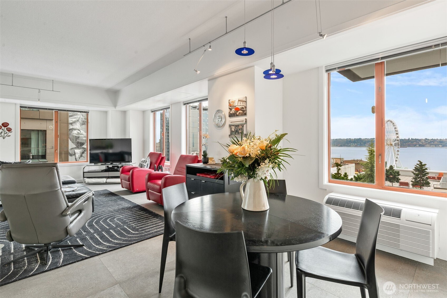 98 Union Street, Unit 206 Seattle, WA 98101 - Photo 8 of 35 a view of a dining room with furniture window and outside view