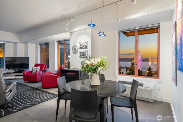 a view of a dining room with furniture window and wooden floor