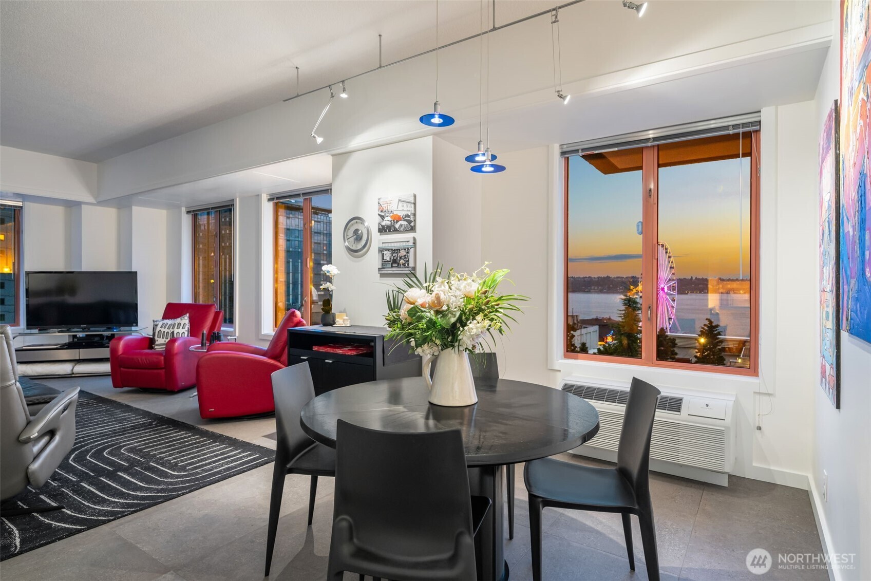 98 Union Street, Unit 206 Seattle, WA 98101 - Photo 9 of 35 a view of a dining room with furniture window and wooden floor