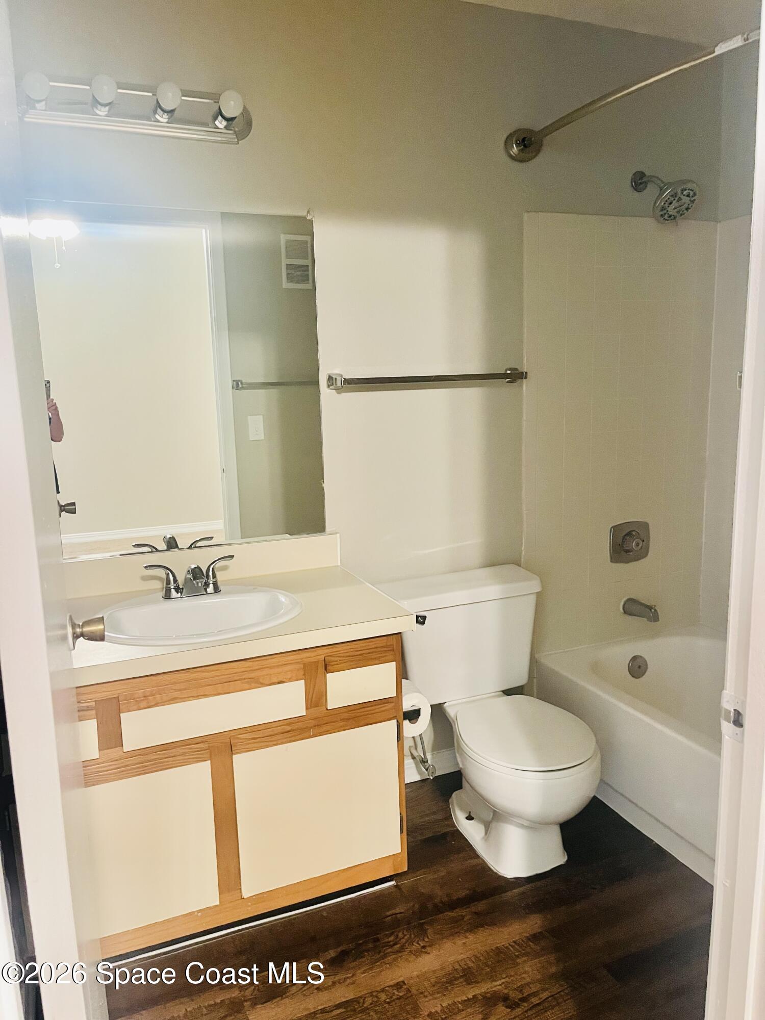 7667 North Wickham Road, Unit 1118 Melbourne, FL 32940 - Photo 14 of 26 a bathroom with a sink toilet and shower