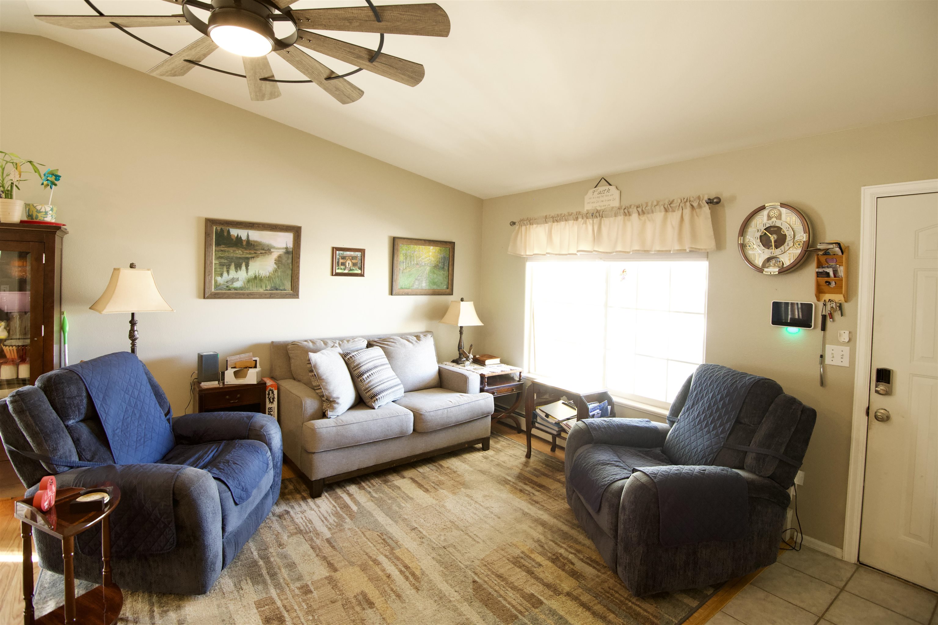 520 April Lane, Unit A Grand Junction, CO 81504 - Photo 2 of 19 a living room with furniture a bed and a window