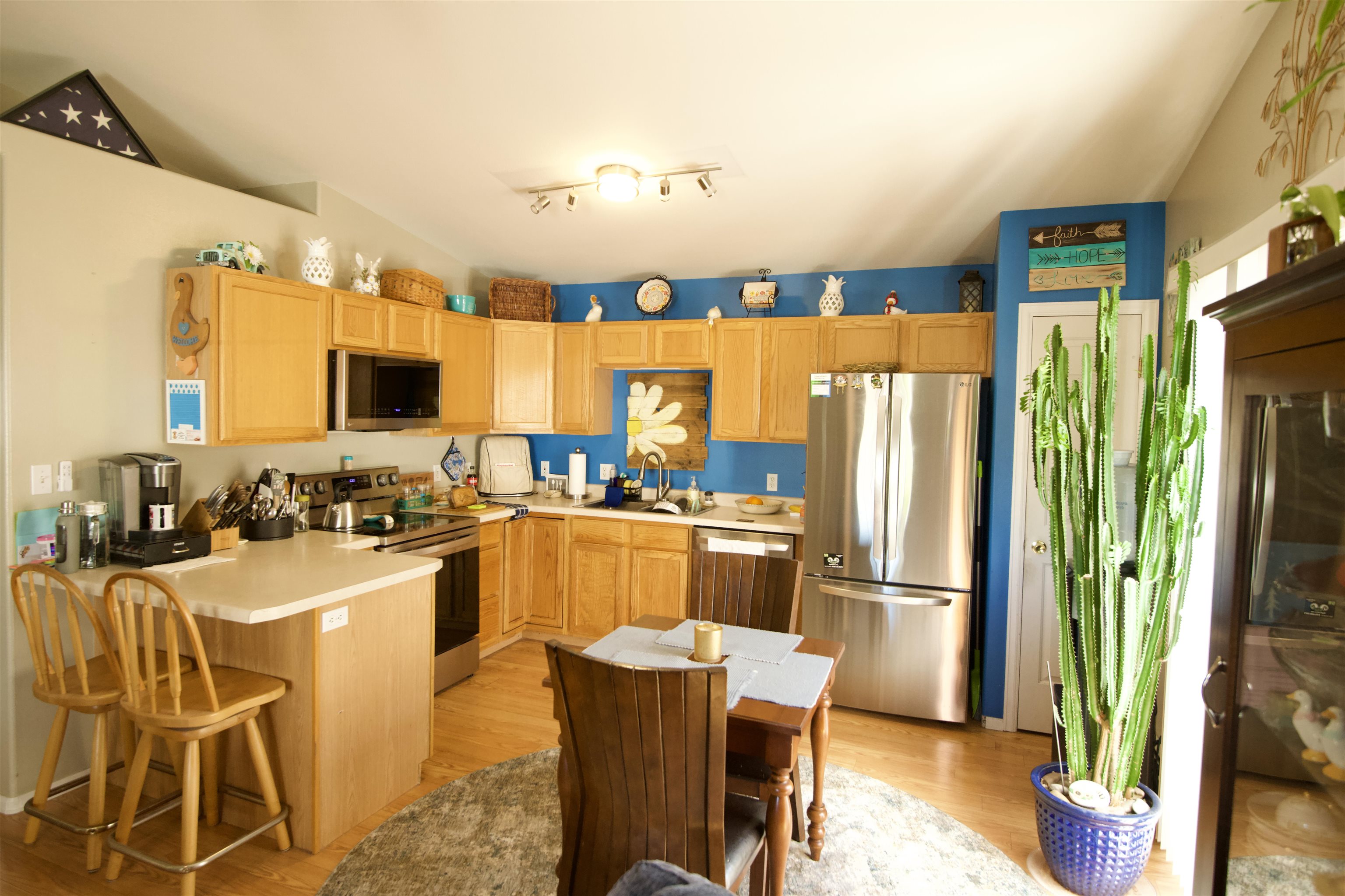 520 April Lane, Unit A Grand Junction, CO 81504 - Photo 4 of 19 a kitchen with stainless steel appliances granite countertop a refrigerator a stove top oven a sink and dining table