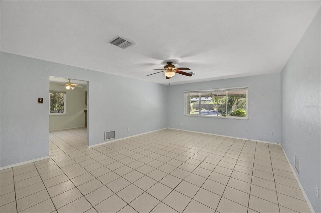 1135 Range Road Englewood, FL 34224 - Photo 14 of 42 a view of an empty room and chandelier fan