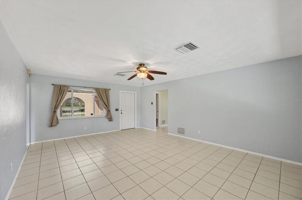 1135 Range Road Englewood, FL 34224 - Photo 16 of 42 a view of an empty room and window