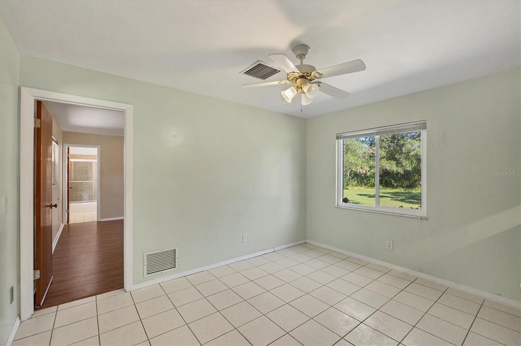 1135 Range Road Englewood, FL 34224 - Photo 22 of 42 a view of an empty room and window