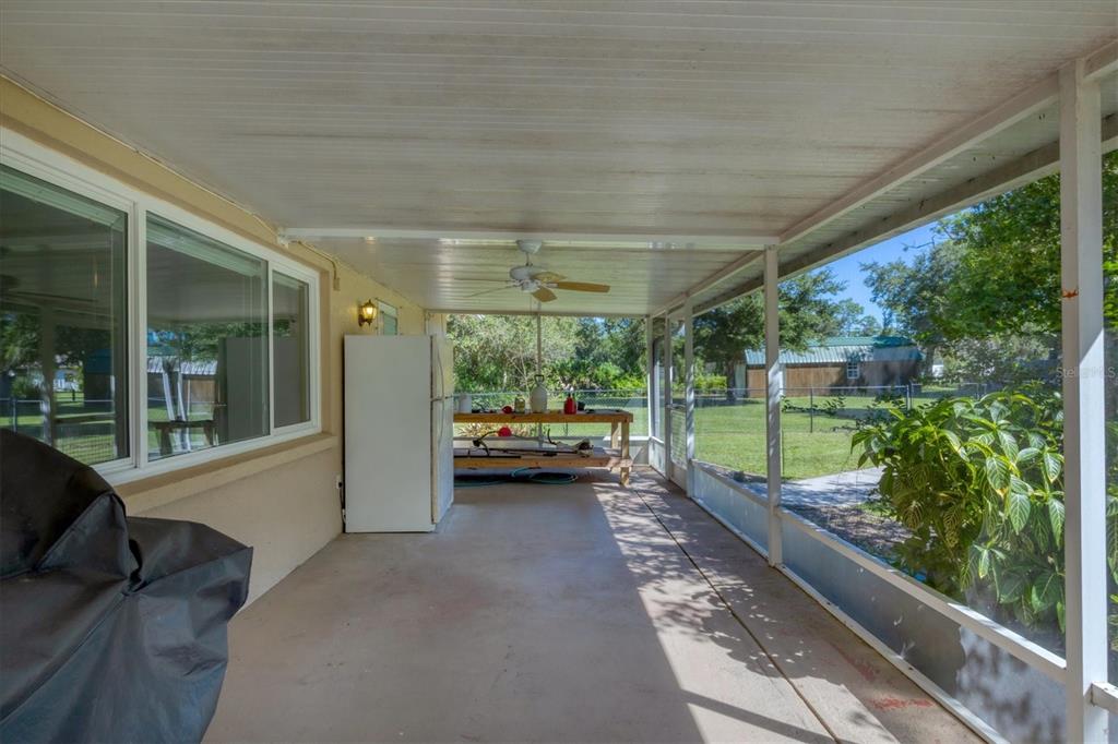 1135 Range Road Englewood, FL 34224 - Photo 33 of 42 a view of a porch with furniture and garden