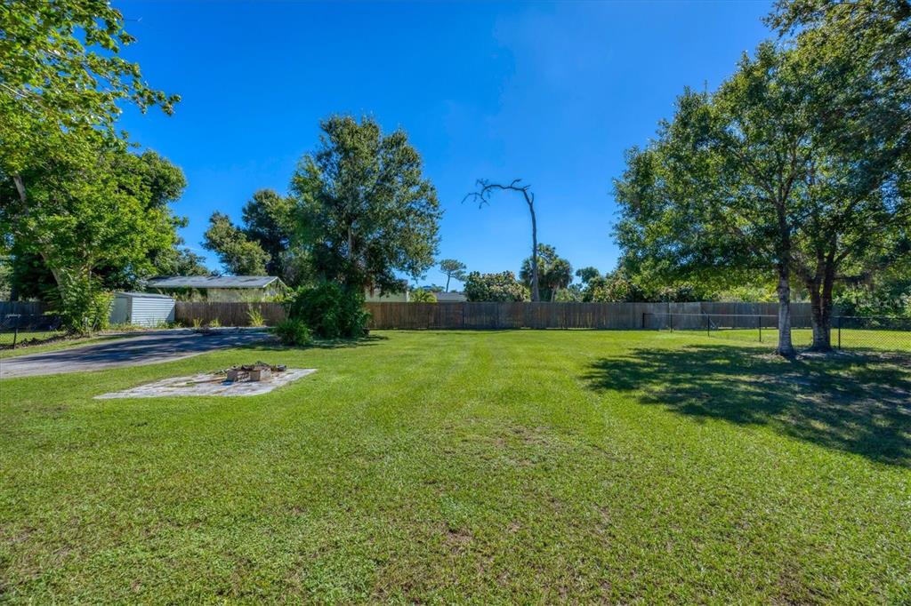 1135 Range Road Englewood, FL 34224 - Photo 34 of 42 a front view of a house with garden