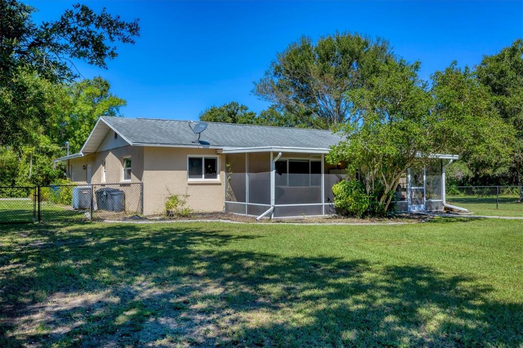 1135 Range Road Englewood, FL 34224 - Photo 35 of 42 front view of a house with a yard