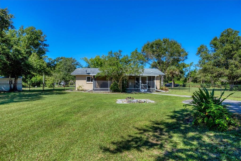 1135 Range Road Englewood, FL 34224 - Photo 37 of 42 a view of a house with a backyard