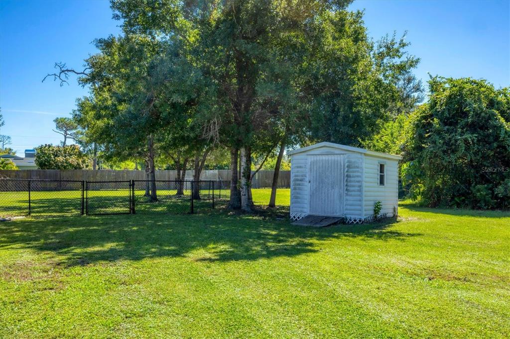 1135 Range Road Englewood, FL 34224 - Photo 38 of 42 a view of a house with a yard