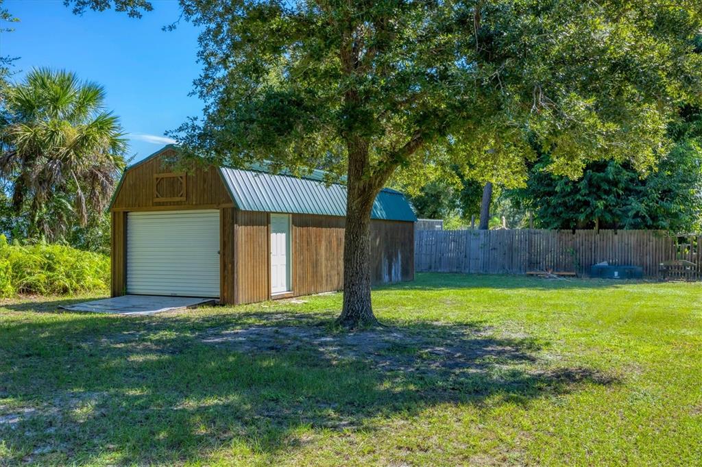 1135 Range Road Englewood, FL 34224 - Photo 39 of 42 a front view of a house with garden